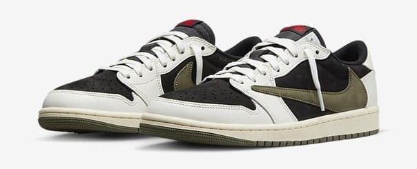 Side view of white, black, and green Jordan sneakers.